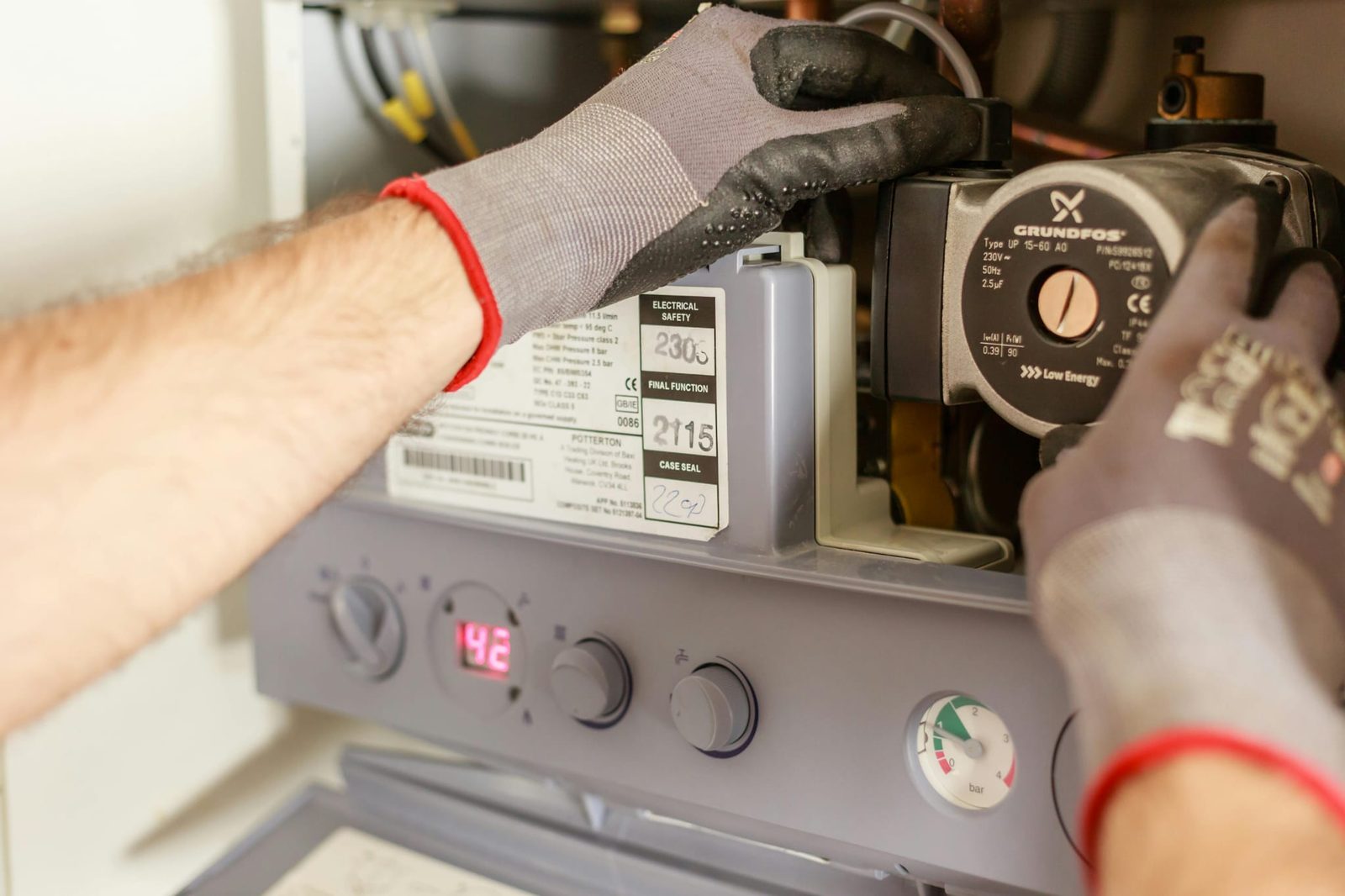 Keyheat Solutions engineer working inside an open gas boiler