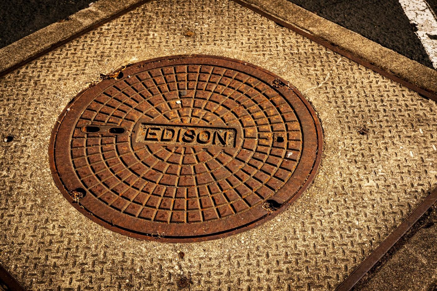 Cast iron manhole cover giving access to a home drainage system