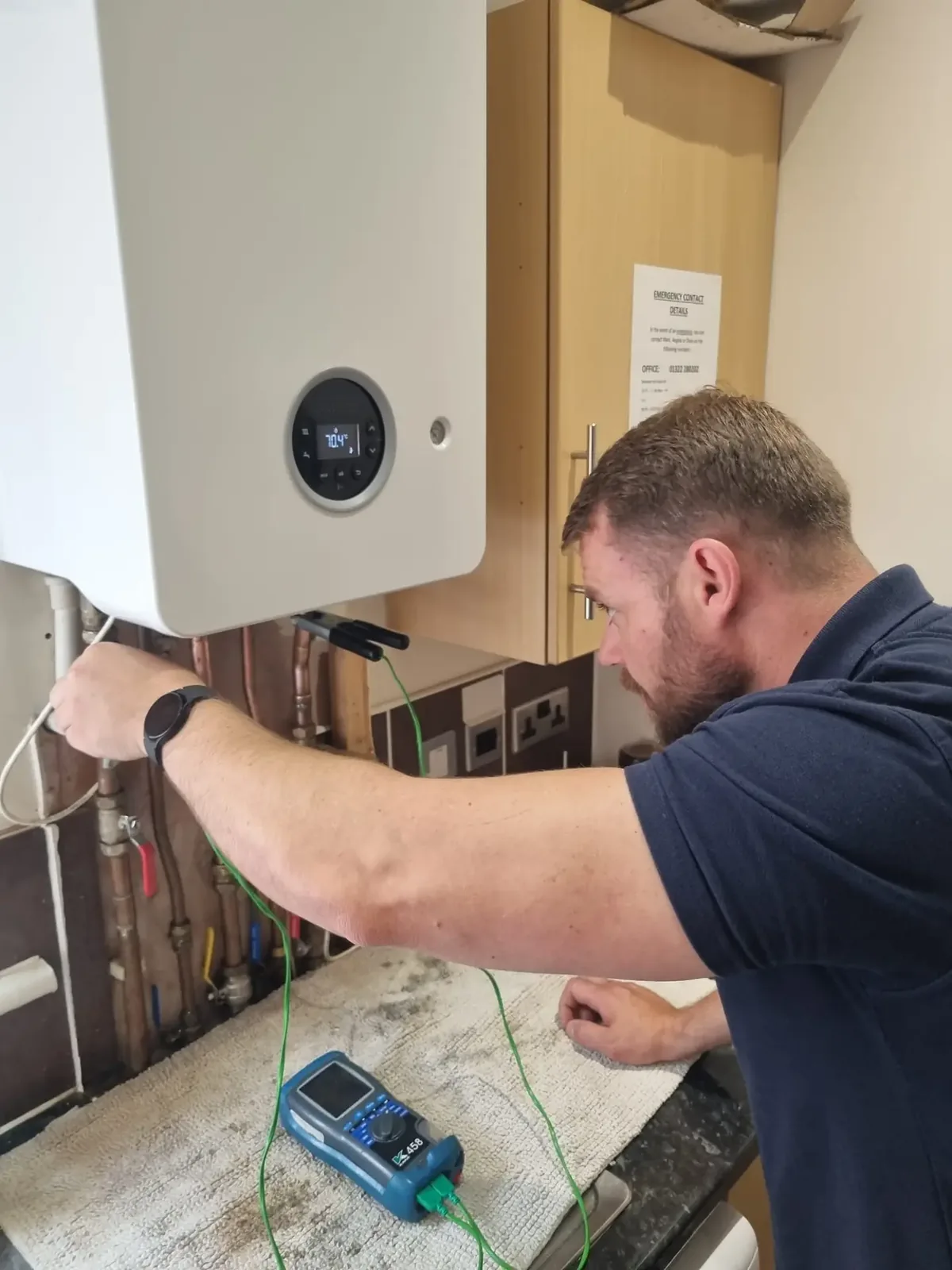 Rowan, owner and lead engineer at Keyheat Solutions, testing a boiler on site